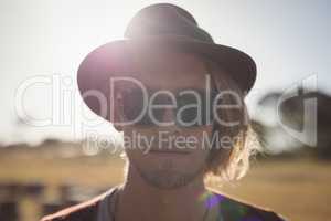 Close up portrait of handsome man standing against clear sky