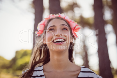 Happy beautiful woman wearing flowers