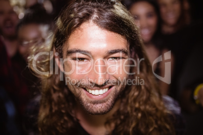 portrait of happy young man at nightclub