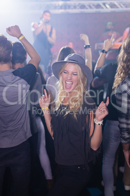 Cheerful woman enjoying in nightclub