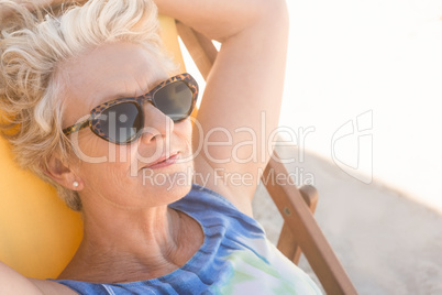 Close up of senior woman relaxing on chair