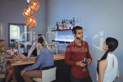 Couple interacting with each other while having drink