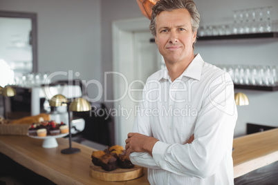 Portrait of waiters smiling at camera