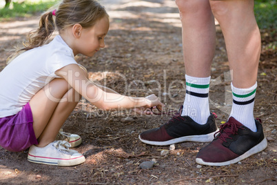 Girl tying her grandfathers shoe laces