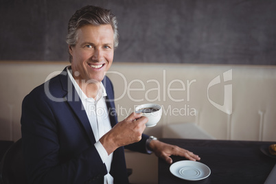 Businessman having coffee in restaurant