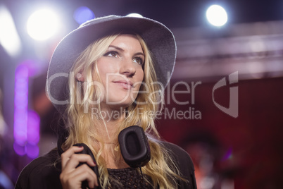 Thoughtful woman with headphones