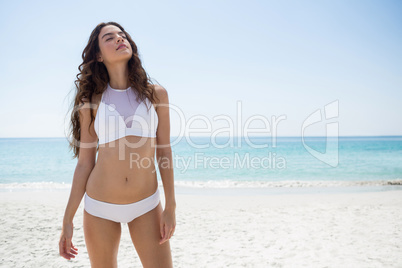 Seductive woman standing at beach