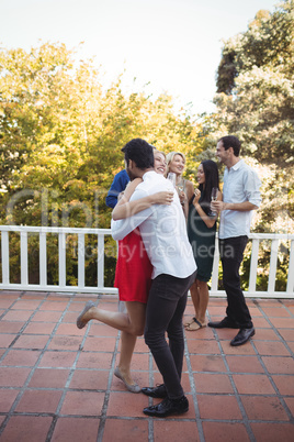 Couple embracing each other in balcony