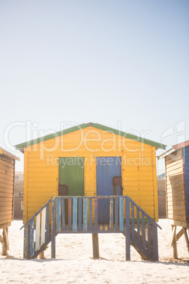 Yellow beach hut on sand