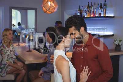 Couple embracing each other at bar restaurant
