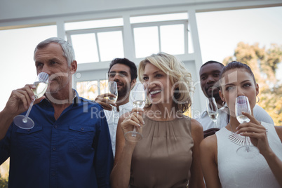 Group of friends having champagne in restaurant