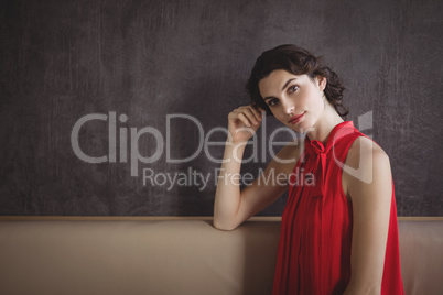 Portrait of beautiful woman in red dress