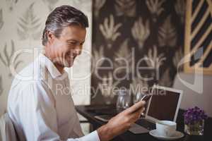 Mature man using mobile phone