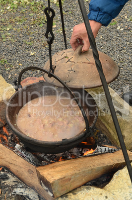 Preparing the goulash on an open fire