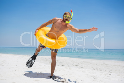 Man with snorkel wearing inflatable ring