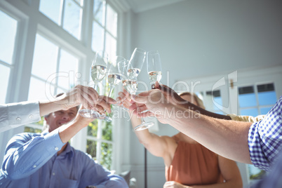 Group of executives toasting glasses of champagne
