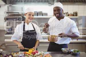 Chefs preparing food in the commercial kitchen