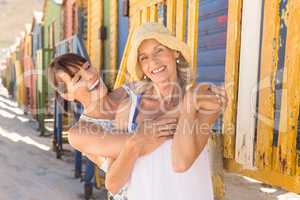 Cheerful mother and daughter embracing