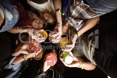 Directly below shot of friends holding drinks
