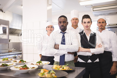 Restaurant manager with his kitchen staff