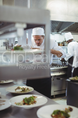 Chef preparing food in the commercial kitchen