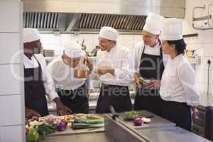 Team of chef tasting food in the commercial kitchen