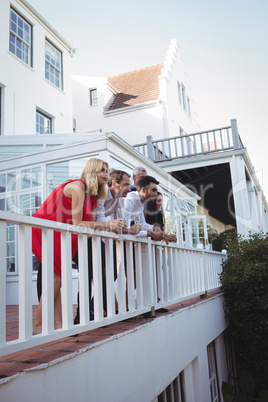 Friends having champagne in balcony