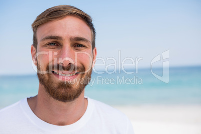 Close up of portrait of smiling man beach