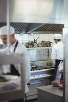 Chefs preparing food in the commercial kitchen