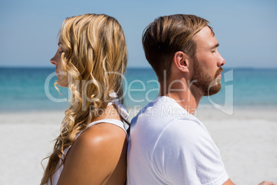 Close up of couple meditating at beach