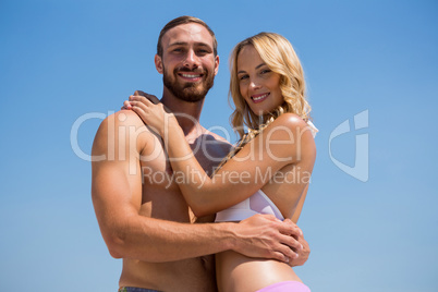 Low angle portrait of smiling couple