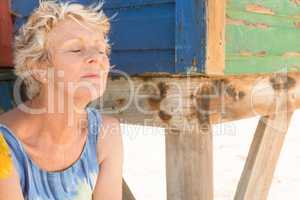 Close up of senior woman with eyes closed