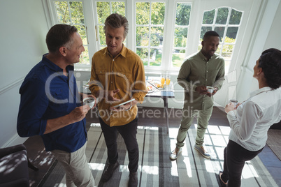 Group of friends interacting while having coffee
