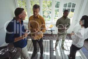 Group of friends interacting while having coffee