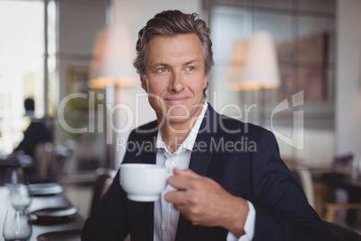 Businessman using laptop in restaurant