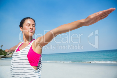 Woman with exercising at beach