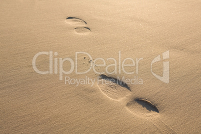 Close up of footprints on sand