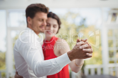 Romantic couple dancing with hand in hand