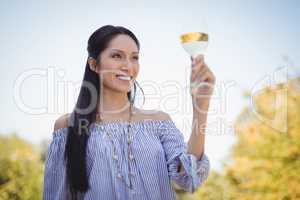 Young woman holding a wine glass