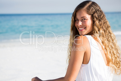 Portrait of happy young woman at beach