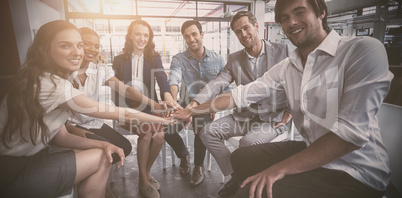 Business people forming hand stack