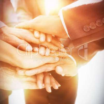 Business team stacking hands together