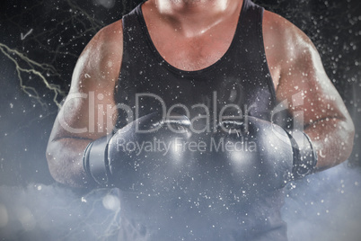 Composite image of mid section of muscular boxer