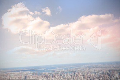 Composite image of blue sky with white clouds