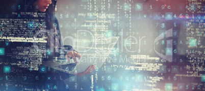 Composite image of serious female hacker using laptop while standing