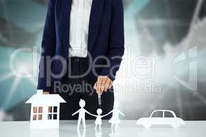 Composite image of woman drawing a car, a family and a house