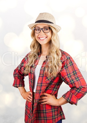 Portrait of happy female hipster standing with hands on hip