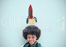 Smiling woman with rocket over head