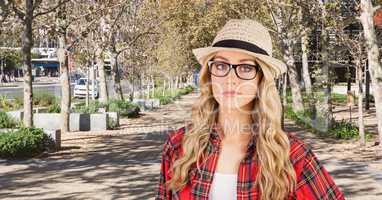 Female hipster wearing sunhat in park