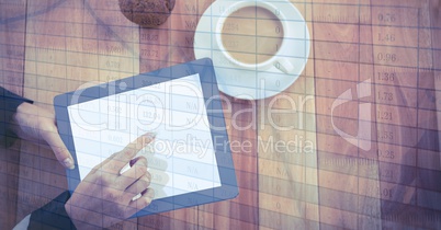 Hands touching digital tablet by coffee cup with overlay